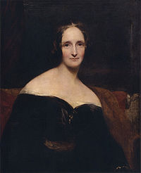 Demi-longueur portrait d'une femme vêtue d'une robe noir assis sur un canapé rouge. Sa robe est de l'épaule, exposant ses épaules. Les coups de pinceau sont larges.