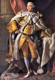Pleine longueur portrait à l'huile d'un jeune homme, rasé de près en robe du XVIIIe siècle: veste or et culottes, manteau d'hermine, perruque poudrée, bas blancs et souliers à boucles.